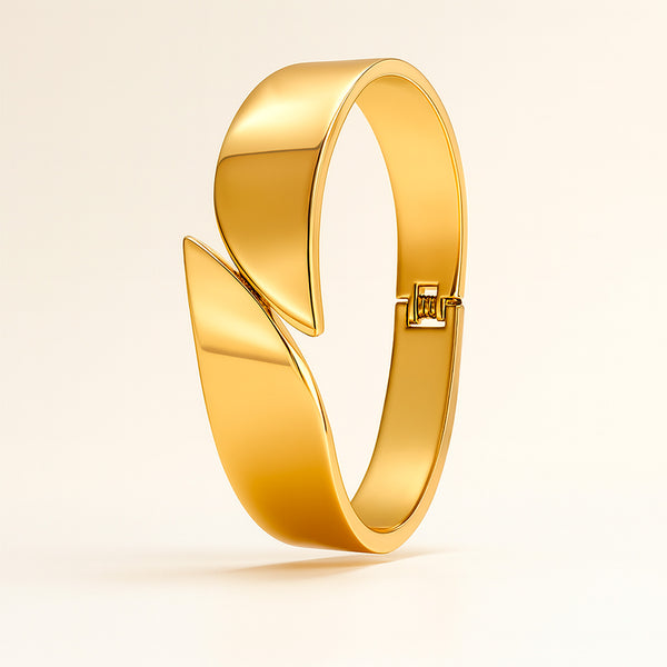 Gold bracelet with a unique design on a beige background